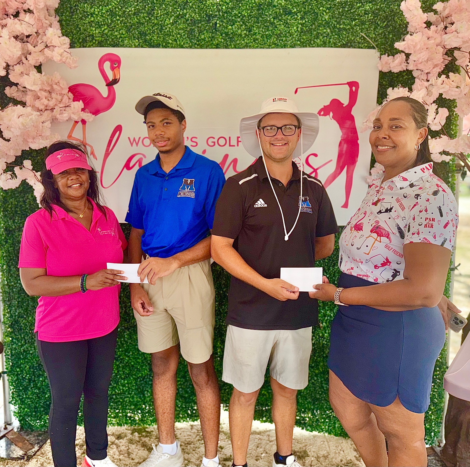 University of The Bahamas Mingoes men&rsquo;s golfers Darrius Thompson (blue shirt)) and Travis Cartwright (black shirt) pose for their third-place finish at the Flamingos Women&rsquo;s Golf Club 242 Tournament, Saturday at the BGF Golf Course.