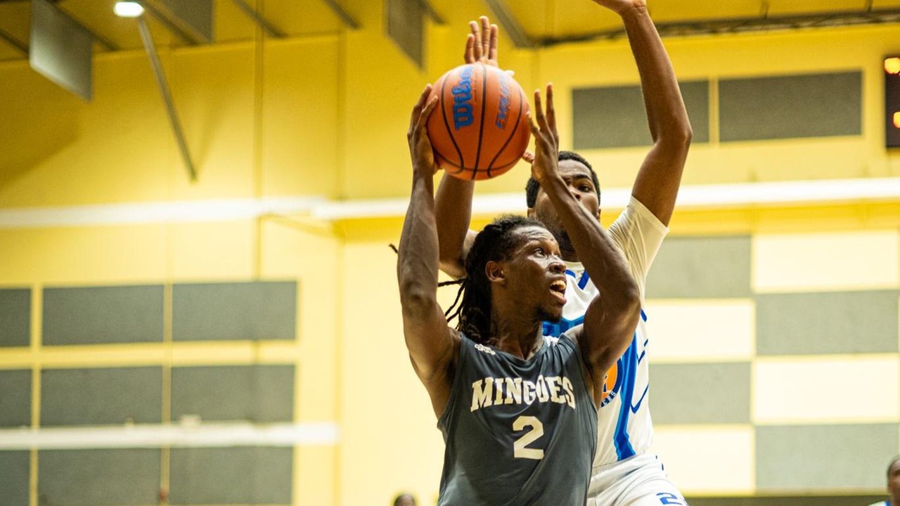 The Mingoes' Erquantae Edgecombe (grey #2) goes up for a layup in a 84-83 win against the Airport Authority Avengers on November 14 at the Kendal Isaacs Gymnasium. He finished with a team-high 24 points.