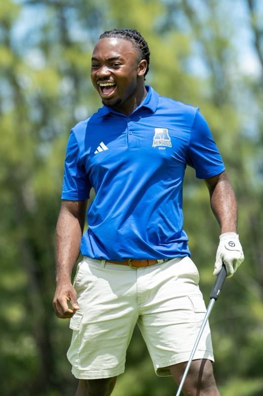 The University of The Bahamas Mingoes men&rsquo;s golfer Lamont Missick celebrates after sinking a putt at the Cleve&rsquo;s Helpers Charity Golf Tournament on Sunday, March 29 at the Royal Blue Golf Course at Baha Mar Resort. UB Athletics.