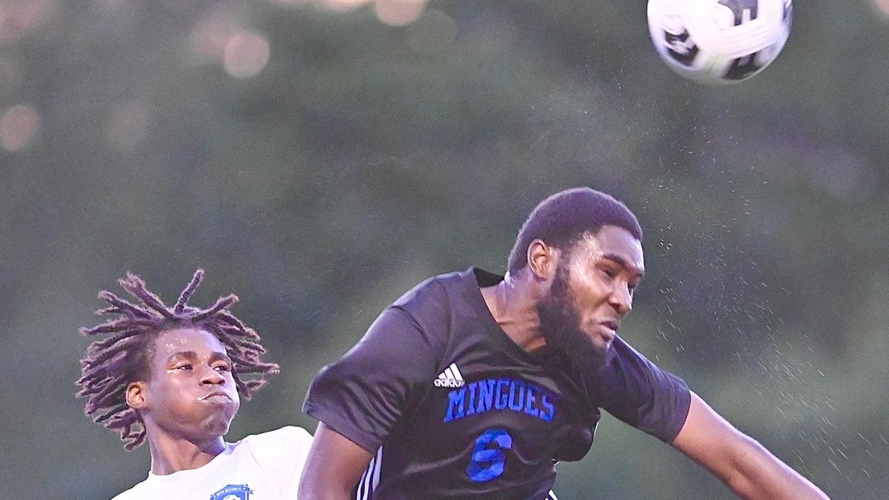 University of The Bahamas right back Alix St. Hilaire (Black #6) goes up for a header against Inter-17 FC Sunday, April 27 at the Roscow Davies Soccer Fields. Mingoes won 3-1. (UB Athletics).
