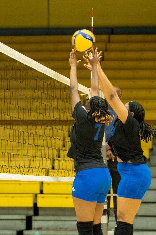 University of The Bahamas Mingoes players Anjeniker Joseph (Black #7) and Zarria go up for a block against Midnight Aces Tuesday, April 8 at the Kendal G L Isaacs Gymnasium. Mingoes won 3-1. (UB Athletics)