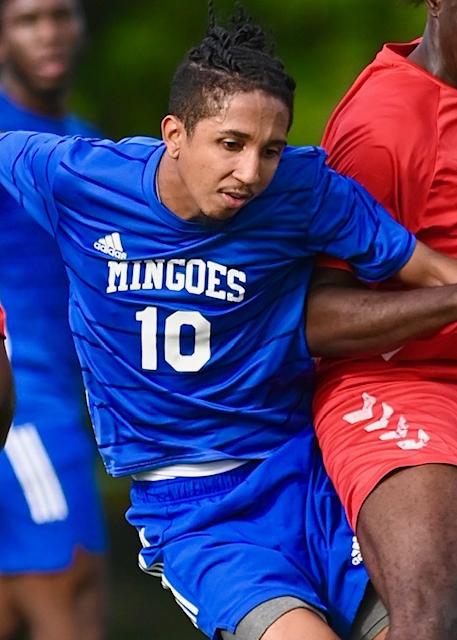 University of The Bahamas Mingoes midfielder Philip Pilgrim (Blue #10) battles for the ball against Cavalier FC Sunday, March 23 at the Roscow Davies Soccer Fields. Mingoes won 3-1. (UB Athletics).