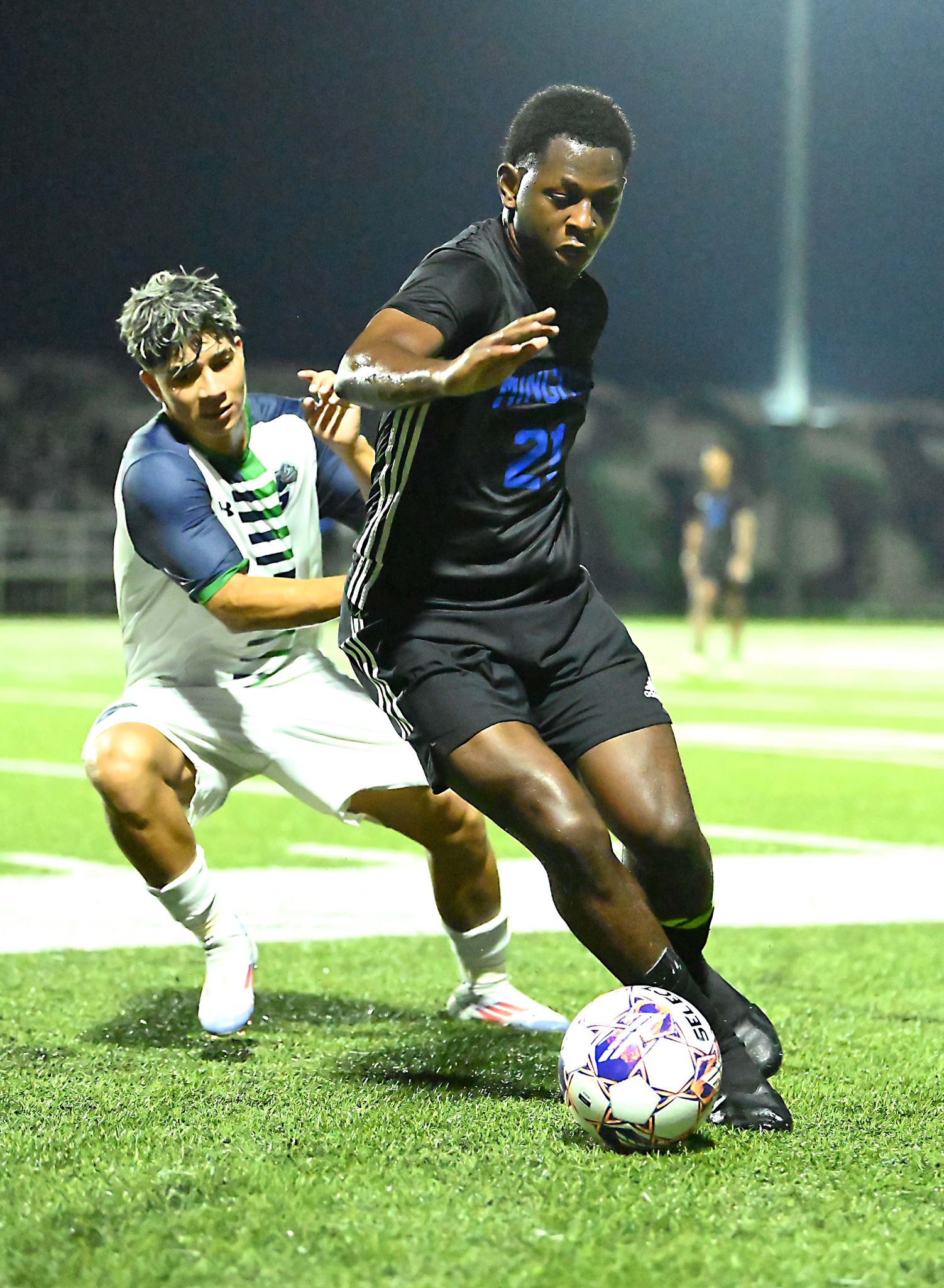 Mingoes' captain Ronaldo Green dribbles around a defender against the Ave Maria University Gyrenes on Thurdsay, August 15 in Naples, Florida. The game finished in a 0-0 draw.