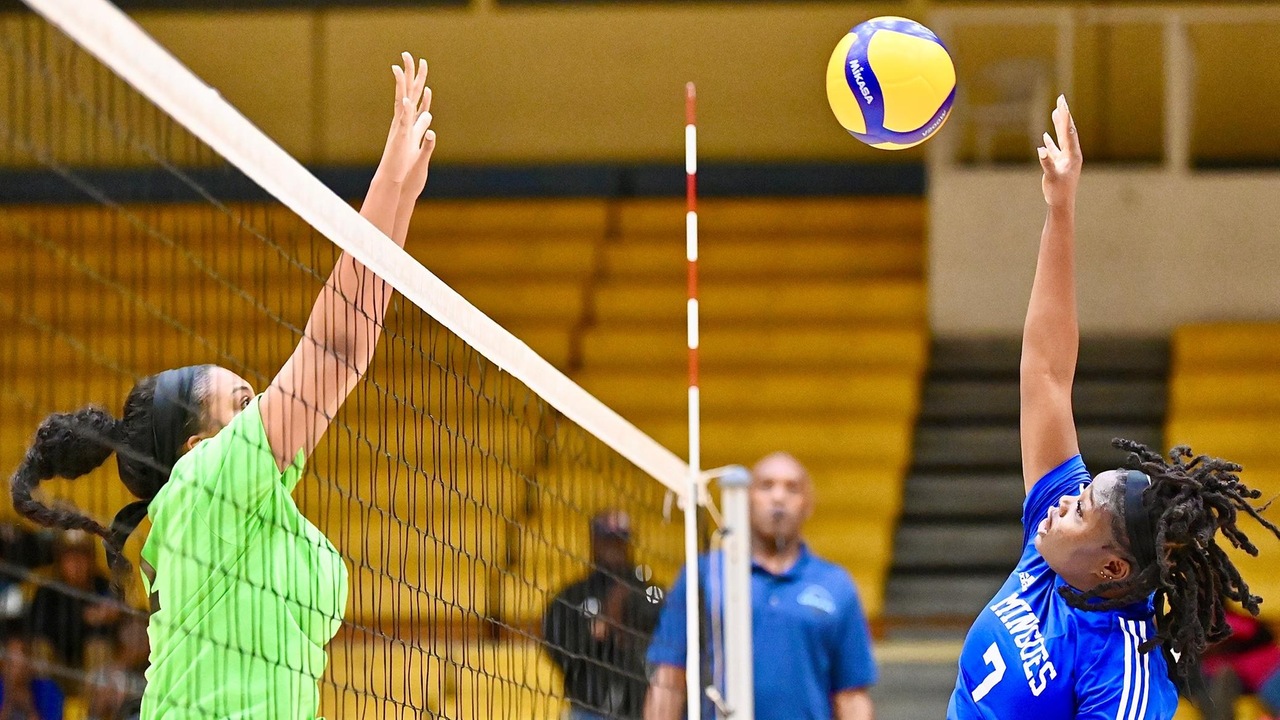 University of The Bahamas Anjeniker Joseph (blue 7) goes up for a spike in The Mingoes game against The Spikers January 7, 2025 at The Kendal Issacs Gym. The Mingoes fell 3-1. (UB ATHLETICS).